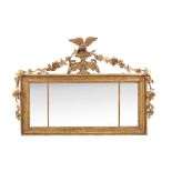 A giltwood and composition triptych wall mirror , late 19th century, with eagle surmount flanked by