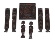 A set of four carved oak pilasters, 17th century, each Doric capital above a stylised tablet