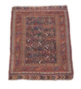 A Shiraz rug, the navy field decorated with polychrome foliate motifs, approximately 174 x 123cm