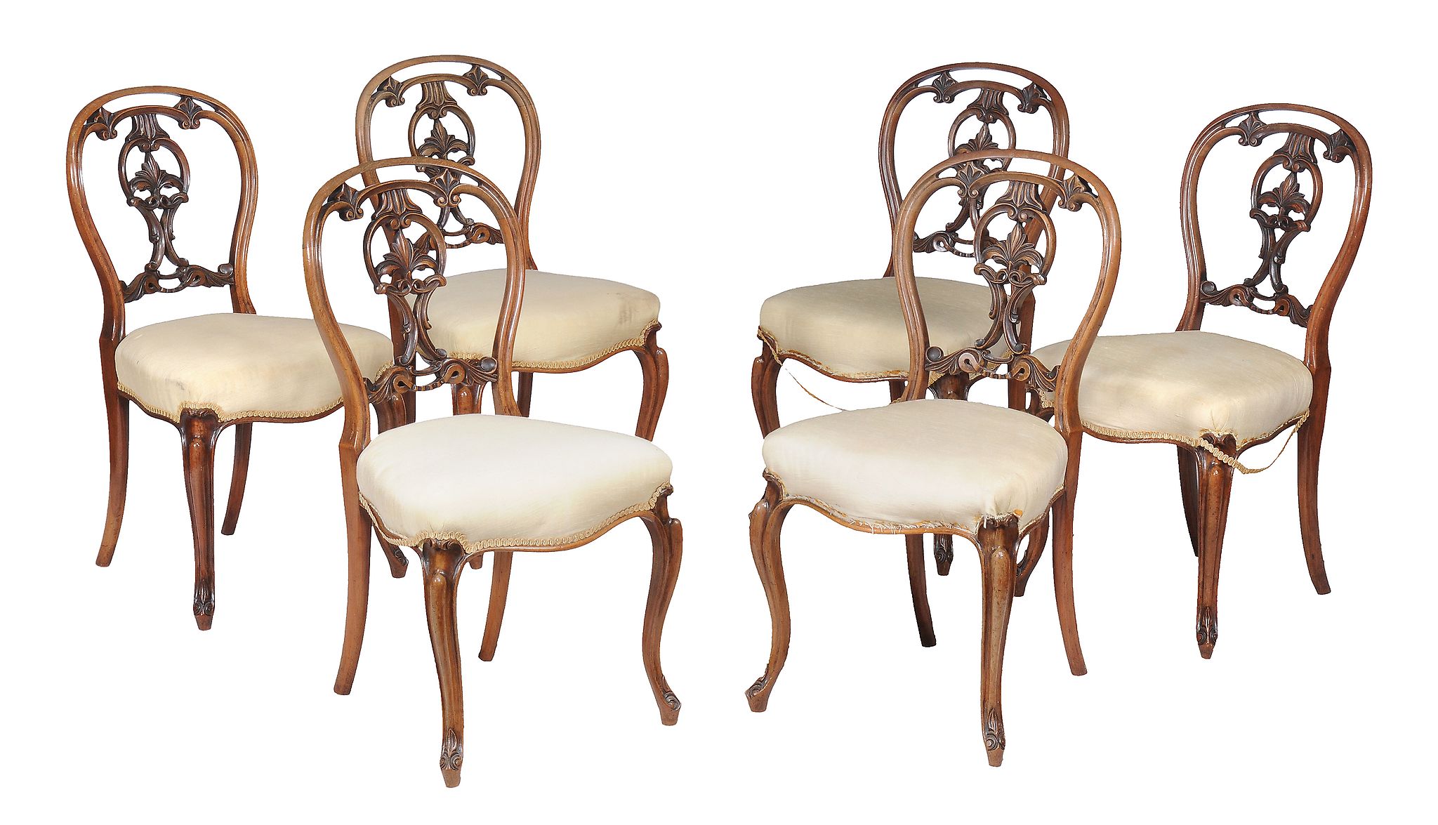 A set of six Victorian walnut dining chairs , circa 1870, each with decorative vertical splat