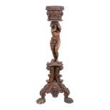 An Italian carved and stained walnut jardiniere stand, mid 19th century, the tapered cylindrical