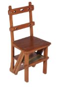 A Victorian metamorphic stained oak occasional chair/library steps , circa 1885, in the form of a