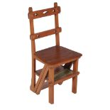 A Victorian metamorphic stained oak occasional chair/library steps , circa 1885, in the form of a