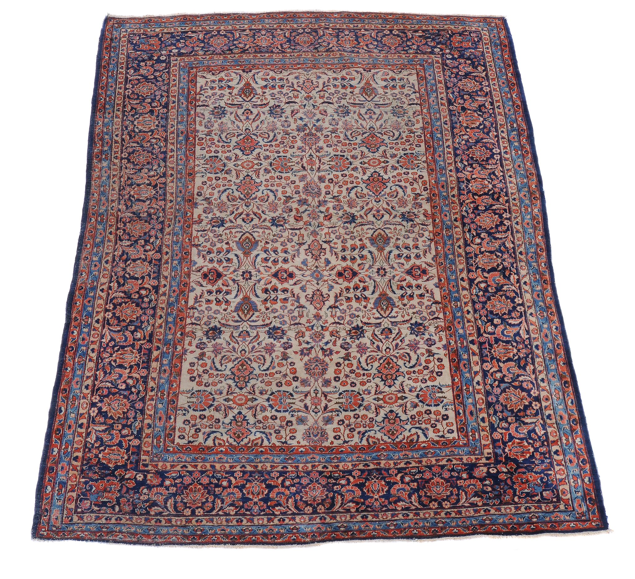 A Kashan rug, the navy field decorated with polychrome foliate motifs, within multiple borders,