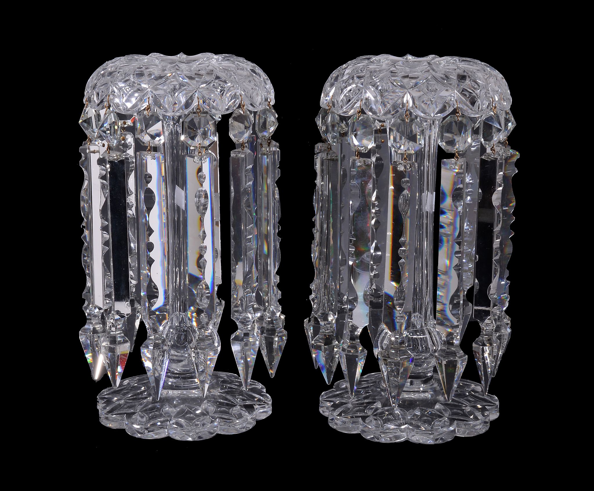 A pair of clear cut-glass candlestick table lustres, third quarter 19th century, the petal-shaped