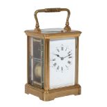 A French brass carriage clock , early 20th century, the eight-day gong striking movement with