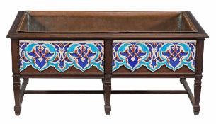 An Arts and Crafts hardwood and tiled planter , circa 1900, the hardwood frame enclosing copper