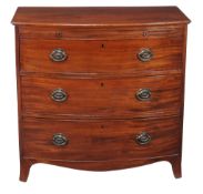 A George III mahogany chest of drawers , circa 1810, of bowfront outline, with brushing slide above