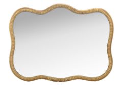 A Continental giltwood wall mirror, late 19th century, of cartouche form, the plate within a