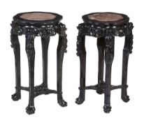 A pair of Chinese carved hardwood stands , late 19th century, 81cm high, 43cm diameter