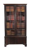 A mahogany cabinet bookcase, circa 1750 and later, the moulded cornice above a pair of astragal