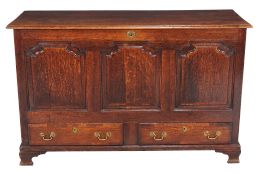 A George III oak mule chest , circa 1780, with three shaped panels above two short drawers and ogee