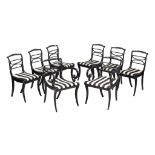 A set of eight Regency ebonised and brass studded dining chairs , circa 1815, to include a pair of