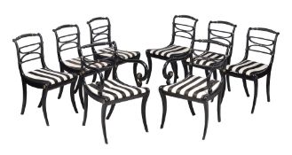 A set of eight Regency ebonised and brass studded dining chairs , circa 1815, to include a pair of