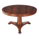 Ω A George IV rosewood centre table, circa 1830, 72cm high, the book-matched veneered top 121cm