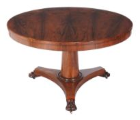 Ω A George IV rosewood centre table, circa 1830, 72cm high, the book-matched veneered top 121cm