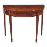 A George III mahogany and kingwood banded folding card table , circa 1790, of semi elliptical form,