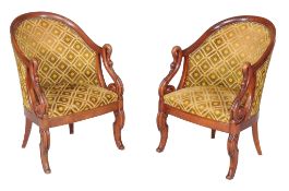 A pair of carved beech tub armchairs in Empire style , late 19th/ early 20th century, each with a