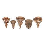 Five carved and giltwood wall brackets, late 19th / early 20th century, one carved with a grotesque