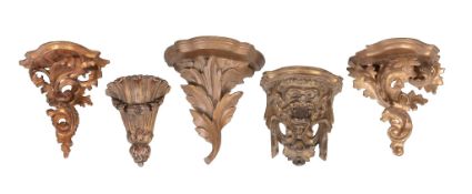 Five carved and giltwood wall brackets, late 19th / early 20th century, one carved with a grotesque