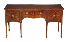A George III mahogany, inlaid and purple heart banded serpentine fronted sideboard, circa 1790, the