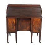 A George III mahogany and inlaid desk, circa 1800, the rectangular top above the sliding tambour