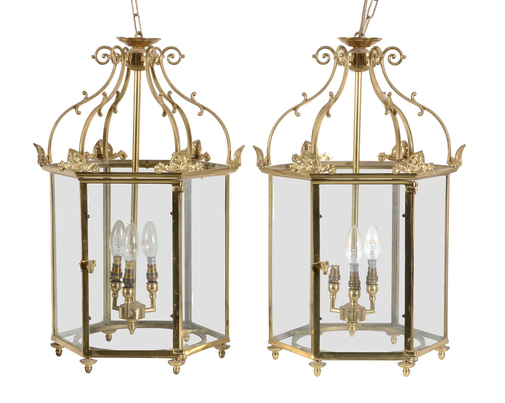 A pair of gilt metal and glazed hall lanterns, 20th century, of hexagonal section, each with six