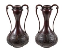 A pair of Art Nouveau bronze twin handled vases , probably Japanese, 29cm high