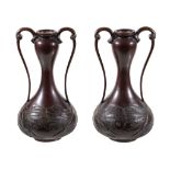 A pair of Art Nouveau bronze twin handled vases , probably Japanese, 29cm high