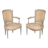A pair of French painted bedroom chairs, in Louis XVI style, late 19th/ early 20th century