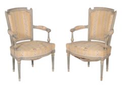 A pair of French painted bedroom chairs, in Louis XVI style, late 19th/ early 20th century