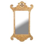 A giltwood wall mirror in George I style , early 20th century, 105cm high, 54cm wide