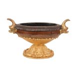 A George IV or William IV carved, stained and part gold painted wood urn, circa 1830, of oval