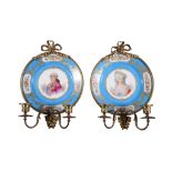 A pair of Sevres style porcelain and gilt metal mounted twin branch wall lights, late 19th century,