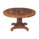 Ω A Victorian goncalo alves centre table , circa 1860, the circular top with mahogany and rosewood
