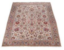 A Tabriz carpet, the cream field decorated profusely with polychrome foliate branches and