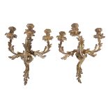 A pair of gilt metal twin light wall appliques in Louis XV taste, first half 20th century, cast as