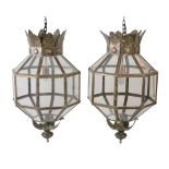 A pair of large patinated sheet metal and glazed lanterns, 20th century, of octagonal section, the