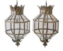 A pair of large patinated sheet metal and glazed lanterns, 20th century, of octagonal section, the