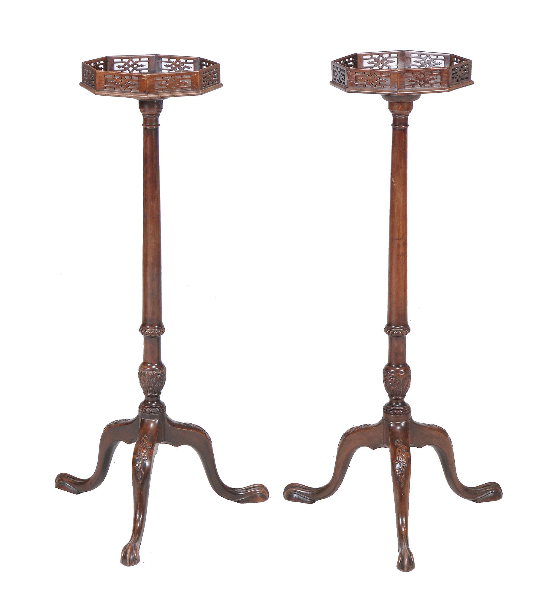 A pair of mahogany torcheres in George III style, late 19th/early 20th century, each octagonal top