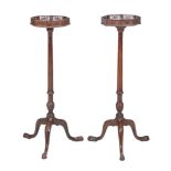 A pair of mahogany torcheres in George III style, late 19th/early 20th century, each octagonal top