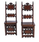 A pair of Italian walnut side chairs, circa 1700, each rectangular back surmounted by carved scroll
