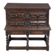 A James II oak two drawer chest, circa 1685, on an associated later base in late17th century