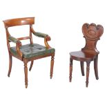 A Regeny mahogany hall chair , circa 1815, the stylised sheild shaped back with vacant cartouche,