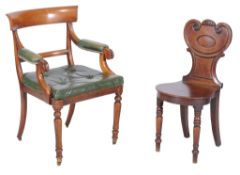 A Regeny mahogany hall chair , circa 1815, the stylised sheild shaped back with vacant cartouche,