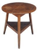 A George III sycamore topped elm cricket table , circa 1780, the circular top above triangular