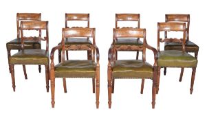 A set of eight George IV mahogany dining chairs, circa 1825, each scrolling bar splat centred by a