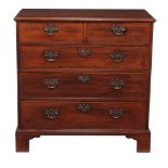 A George III mahogany chest of drawers, circa 1760, the moulded rectangular top above two short and