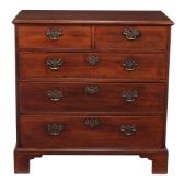 A George III mahogany chest of drawers, circa 1760, the moulded rectangular top above two short and