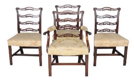 A set of four George III mahogany ladder back dining chairs , late 18th century, after a design by